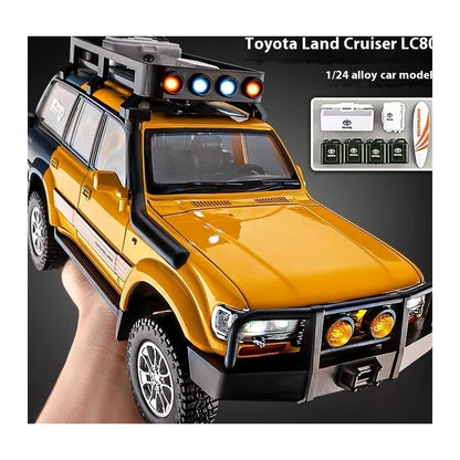 1:24 Toyota Land Cruiser LC80 diecast model - yellow outdoor view